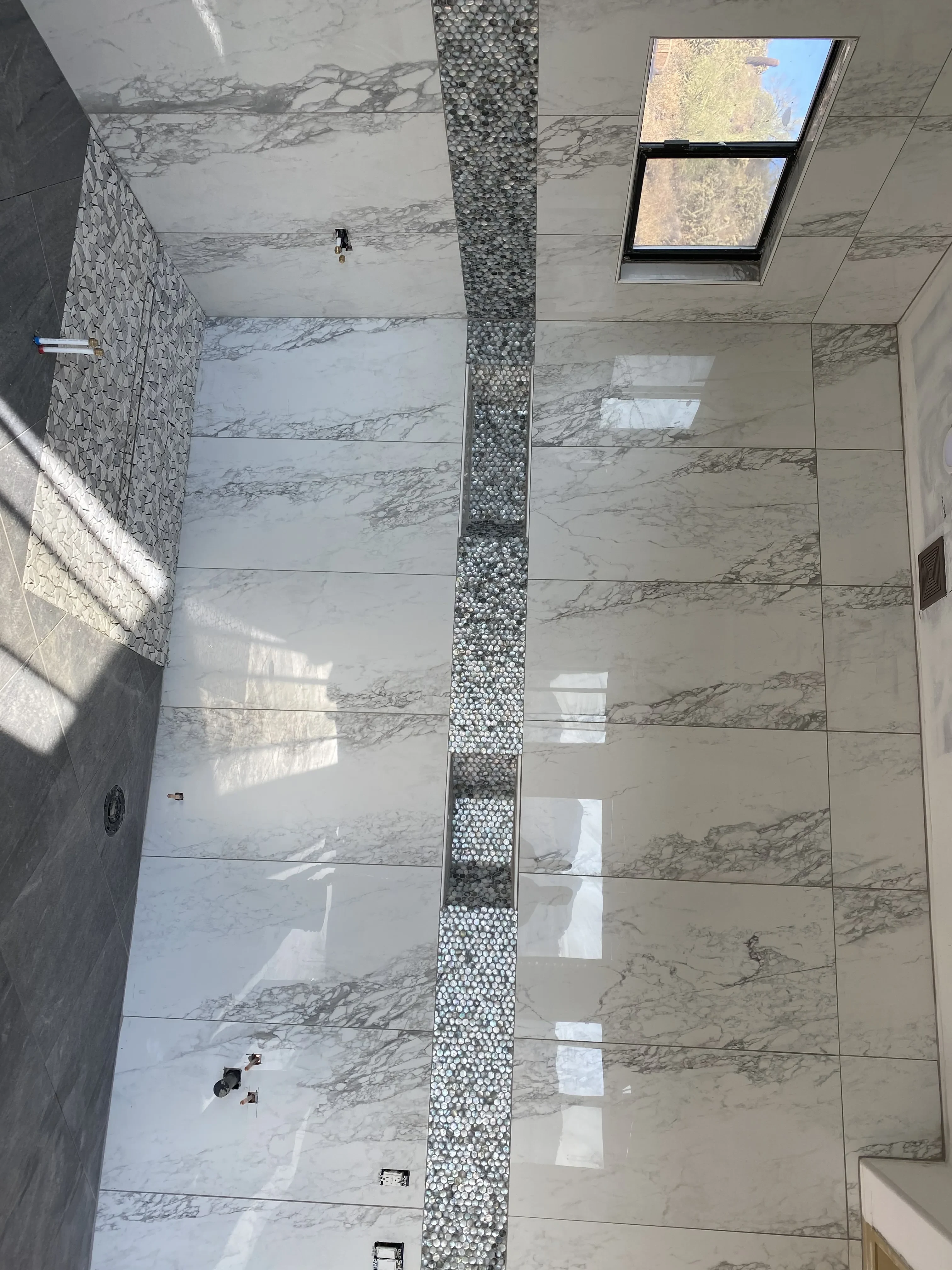 Large Format Calacatta Marble Shower with Penny Tile Niche
