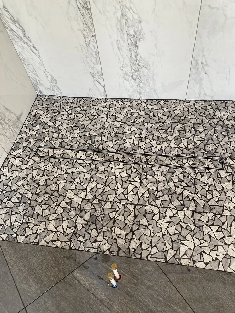 Pebble Mosaic Shower Floor with Marble Walls | Albaner Tile and Stone Phoenix